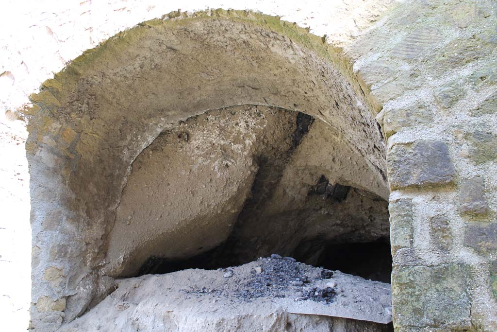 Herculaneum, March 2014. Looking north into the unexcavated at the rear of the four-sided Arch, on Decumanus Maximus.  
Foto Annette Haug, ERC Grant 681269 DÉCOR.